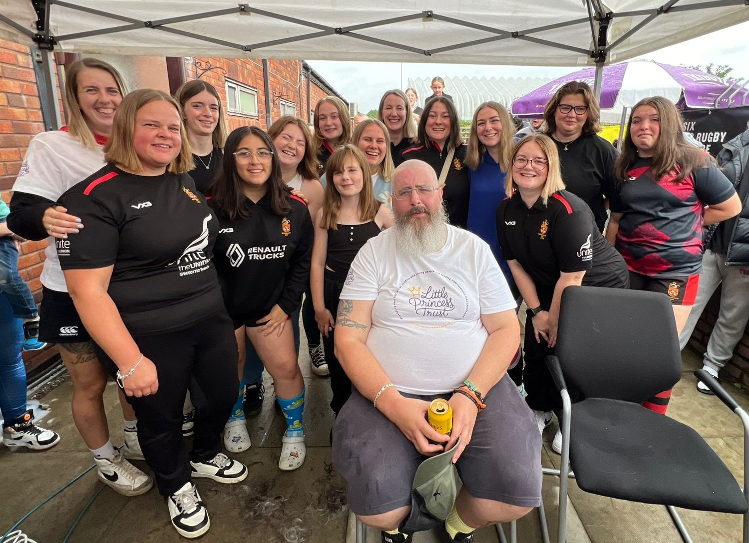 Simon Johnston, front, with Avonmouth Claire's Ladies team, after the big chop in aid of The Little Princess Trust.