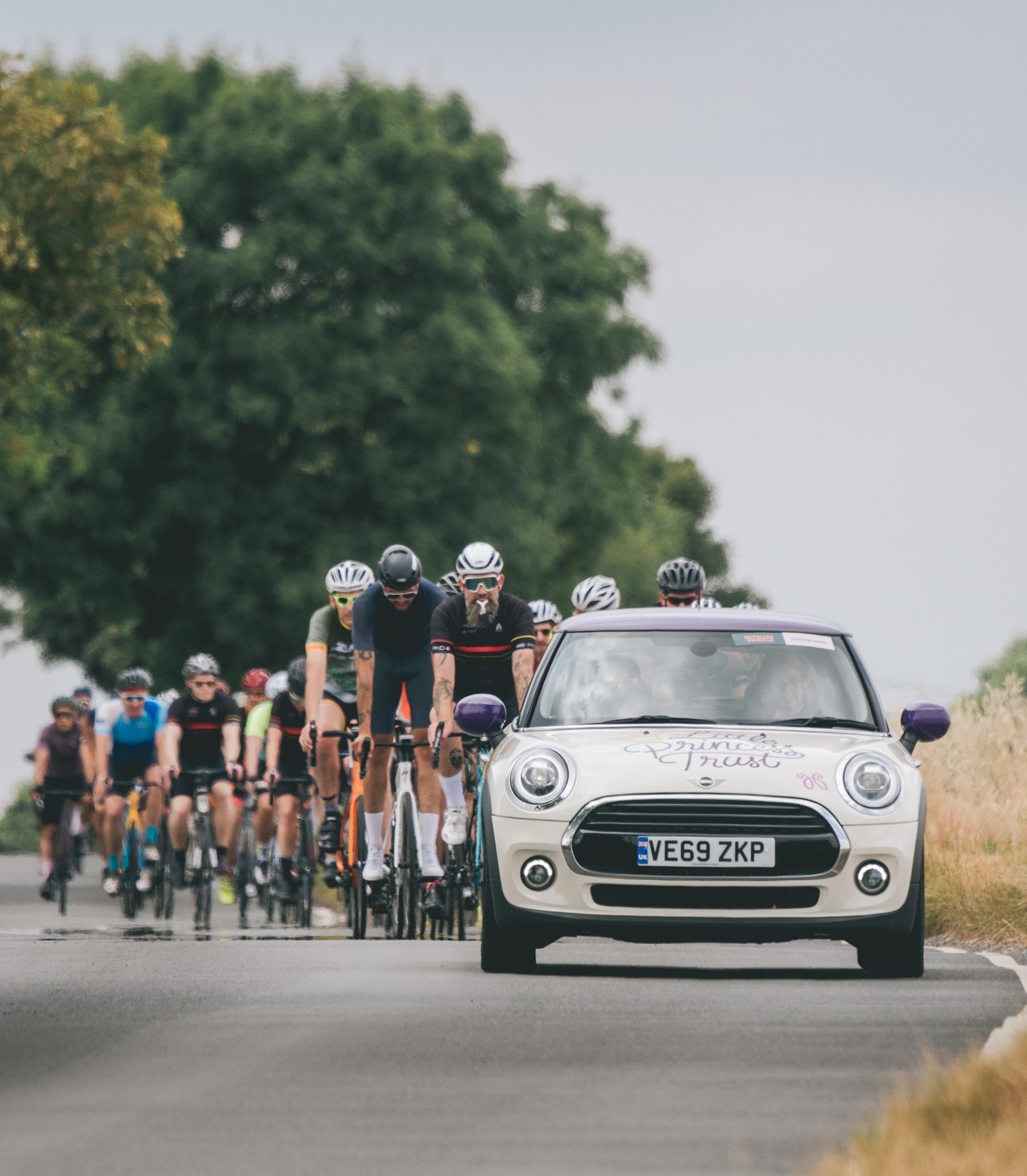 The Little Princess Trust Mini, supported by Cotswold BMW Hereford, leads the cyclists on their way to Paris.