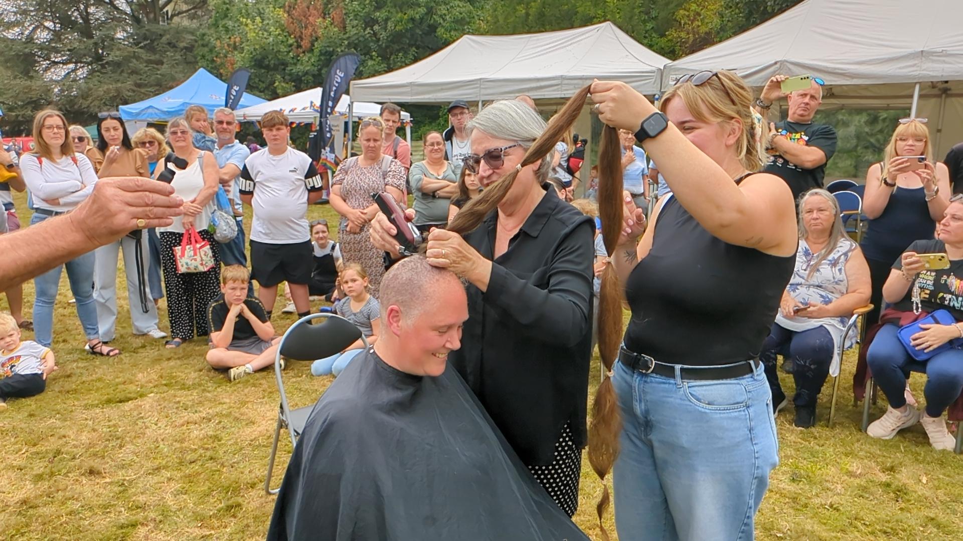 It took two people to cut Ruth's impressive long locks.