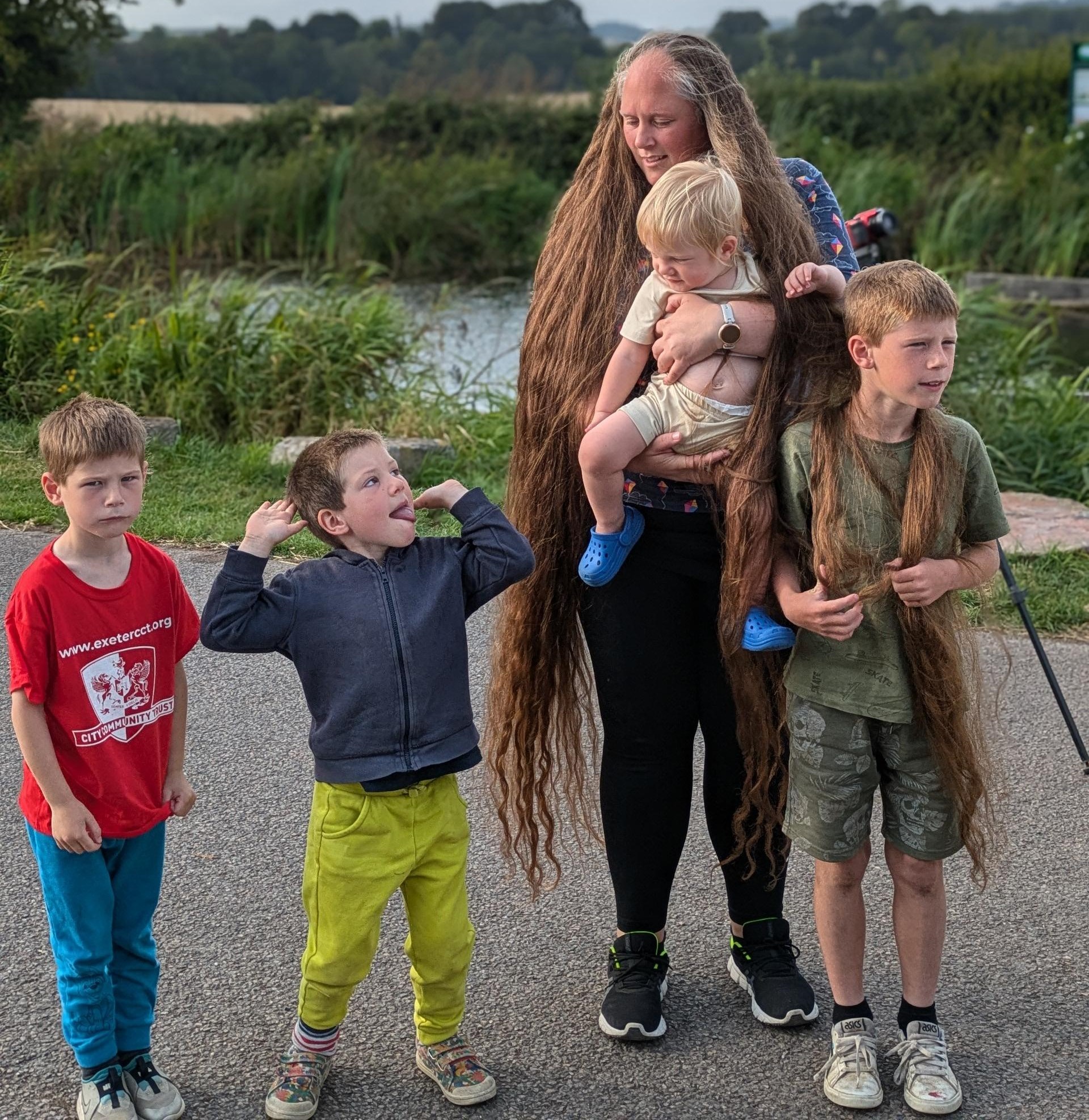 Ruth, pictured with her children, grew her hair until it reached the floor.