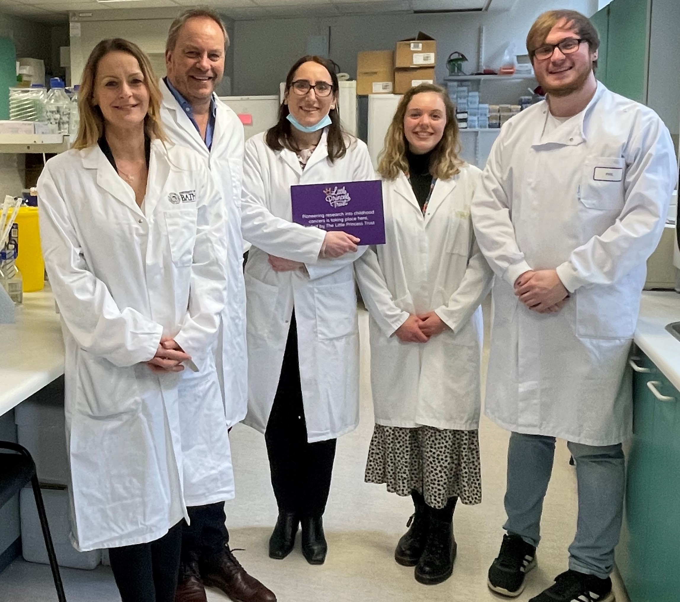 Wendy Tarplee-Morris (left) and Phil Brace (second left) meet Dr Maria Victoria Nikilson Chirou and her team in the lab at the University of Bath.